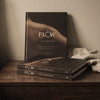 Flow.TheMethod hardcover books on a nightstand